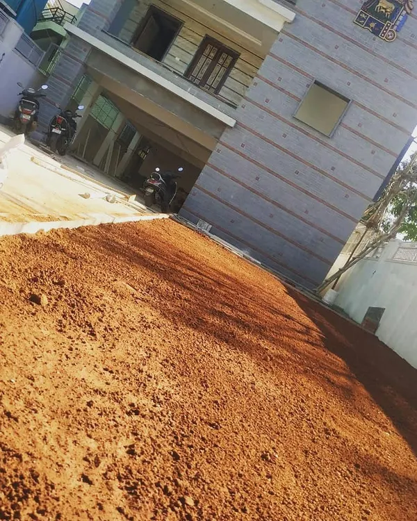 Before: The first step in creating a beautiful lawn is proper ground preparation. Here we have leveled and prepared the red soil for a villa project in Yelahanka.