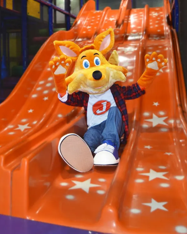 Here he comes! J the Fox makes a grand entrance on the slide, ready to bring smiles and excitement to all the Lil' Cubs.