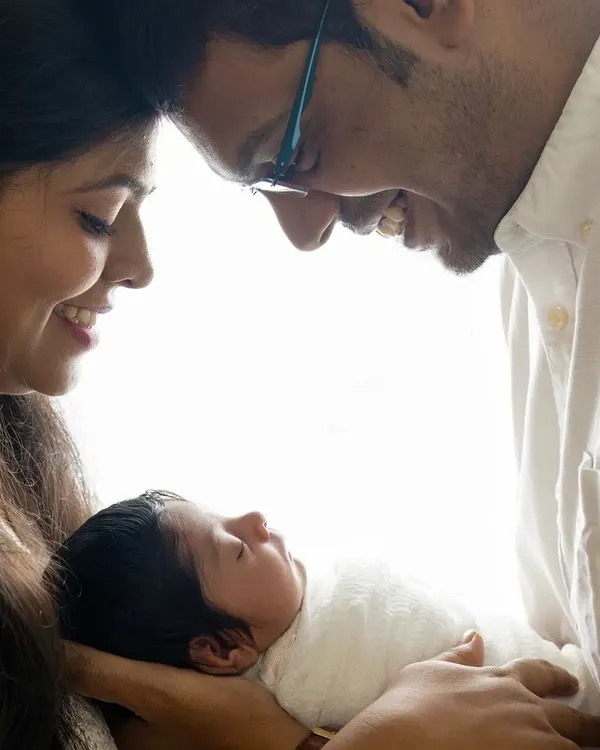 A collection of intimate moments with new parents adoring their newborn baby. I use high-key lighting to create a soft, bright, and emotional feel.