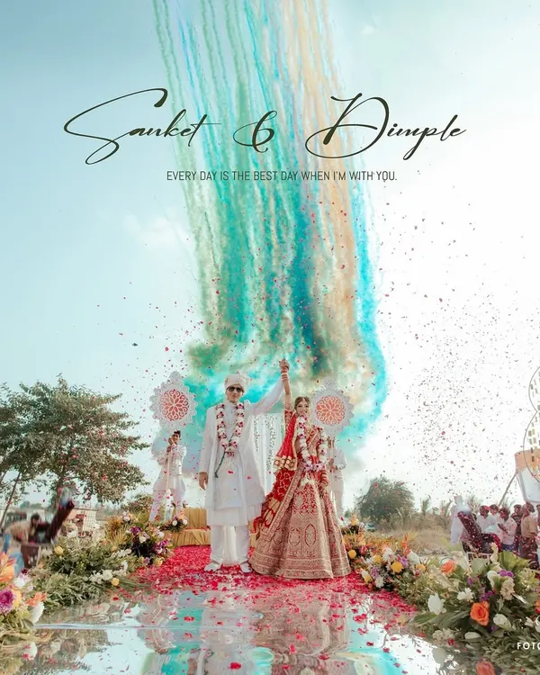 A spectacular moment of celebration as Sanket and Dimple are showered with vibrant colors. We specialize in capturing these grand, explosive moments of joy that define a wedding day, creating an image that is both powerful and unforgettable.