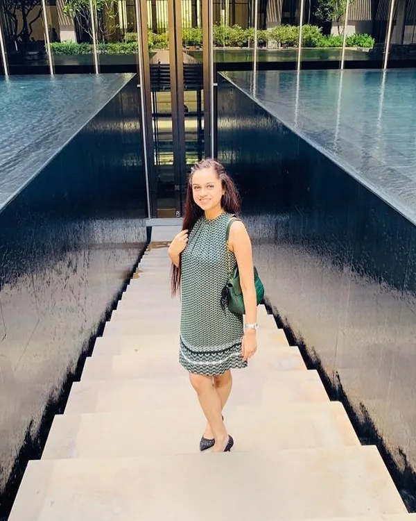 Taking a moment in a chic, printed summer dress. This outfit is all about effortless style, combining a comfortable silhouette with a timeless pattern, perfect for a serene day out.