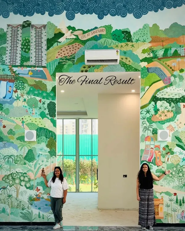 The final result of a 400 sq ft mural for a real estate sales center in Greater Noida. The artwork visualizes the theme of sustainable community living, showcasing the amenities and green spaces offered in the project.