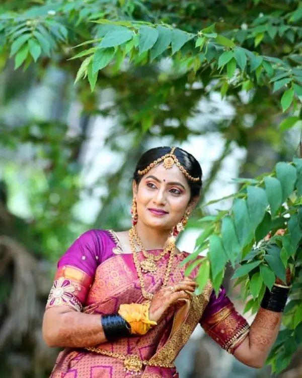 A beautiful outdoor shot of my bride Gagana. The natural light highlights the flawless makeup base and the rich colors of her silk saree.