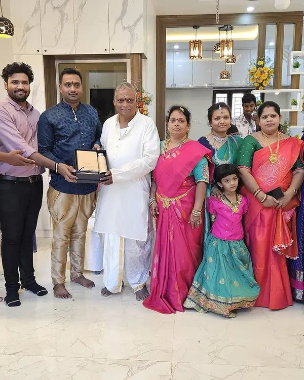 A proud moment with a happy family at their housewarming ceremony. Handing over a completed home to our clients is the most rewarding part of our work.