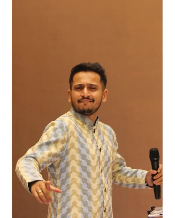 A candid, unposed smile during a performance. These are the moments of pure joy I find on stage, connecting with the music and the audience in a real and authentic way.