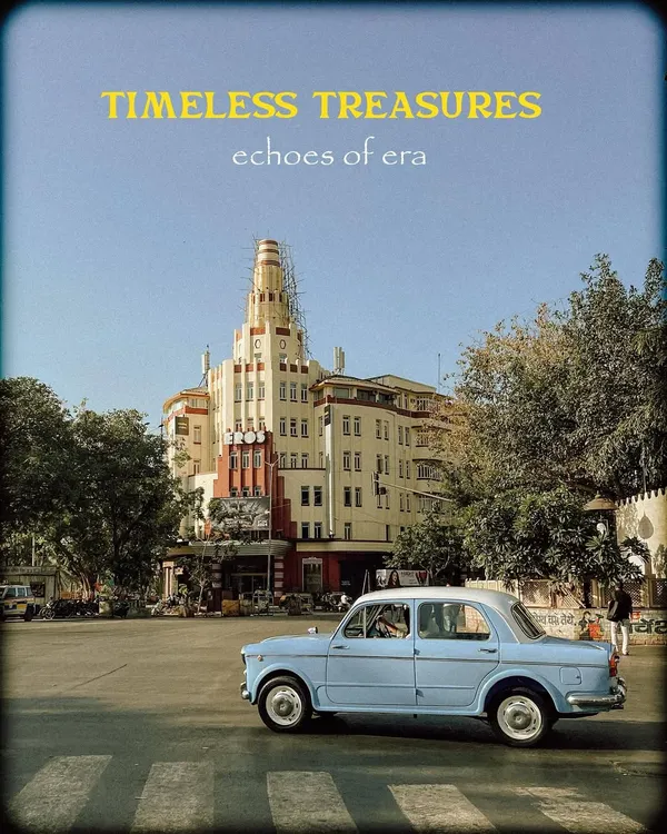 A classic Fiat car parked before an Art Deco building, capturing the "Timeless Treasures" of Mumbai. This shot perfectly blends vintage automotive design with the city's unique architecture.