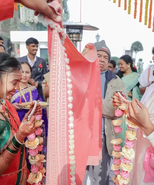 The 'Antarpat' ritual in a Maharashtrian wedding is full of sweet anticipation. We captured the moment just before the cloth is lowered, as Ketaki and Abhimanyu prepare to see each other for the first time at the altar.