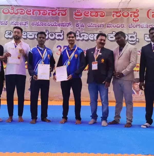 Here I am with fellow athletes after securing first place at the 5th Karnataka State Level Yogasana Competition. This victory qualified me for the national championships.