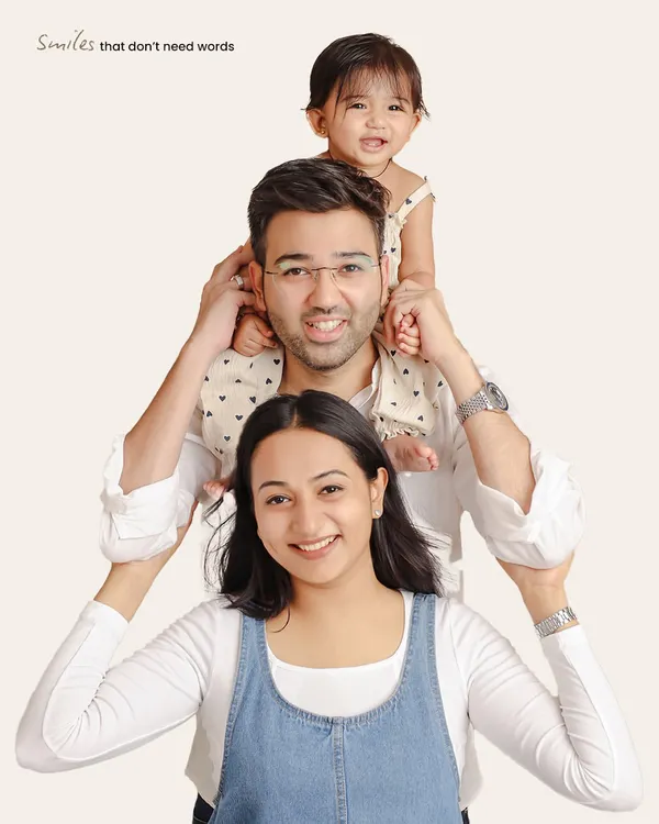 I love getting creative with family poses. This playful "totem pole" arrangement is a fun way to capture the family's personality and create a photo that is full of smiles and laughter.