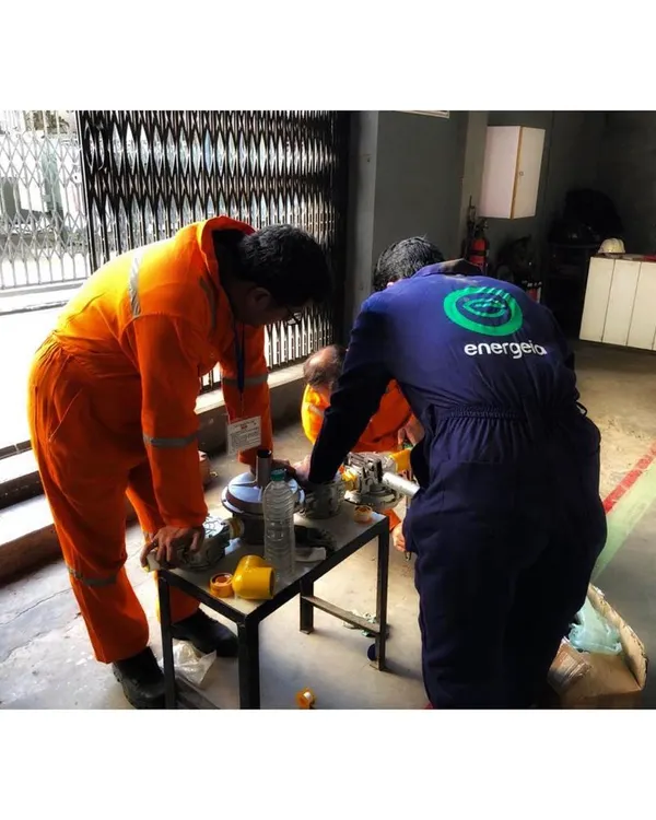 My engineers working together on-site to prepare components for a dual fuel kit installation. This hands-on teamwork is essential to ensuring every project is executed with precision and care, enabling sustainability from the ground up.
