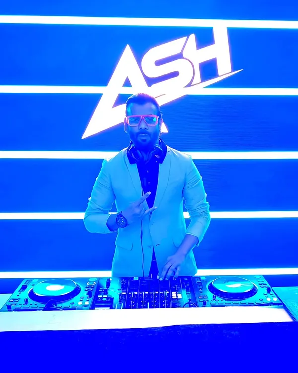 My signature 'ASH' logo displayed on a massive LED screen behind me. This VDJ setup adds a professional and concert-like feel to any corporate event or festival.