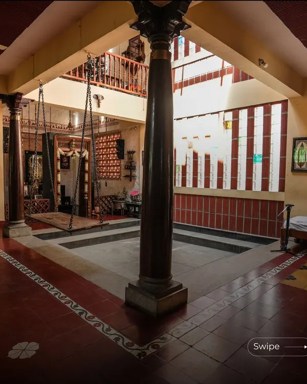 A home should be a sanctuary, a space that feels both timeless and personal. Here, in the heart of the Padmaja Rao Residence, a traditional courtyard with a central swing becomes a place for quiet reflection and connection. The design uses earthy red oxide flooring, majestic wooden pillars, and a skylight that bathes the area in natural light, blending our rich heritage with modern living.