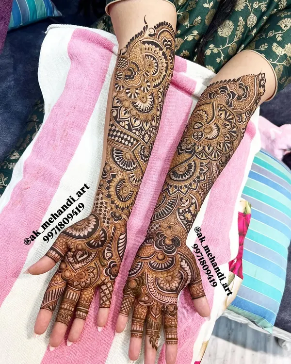 This full bridal design showcases a mix of dense patterns and open spaces. In my classes, you will learn how to balance different elements like paisleys, checks, and floral motifs to create a harmonious composition.