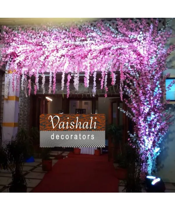 Make a grand entrance with this stunning pink cherry blossom archway. This rental piece is perfect for welcoming guests to a wedding, reception, or any elegant party.