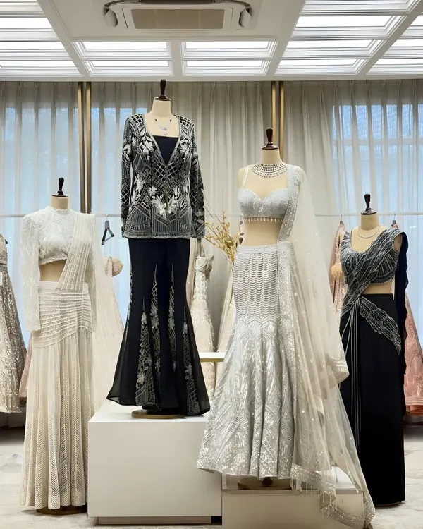 A snapshot of our latest collection on display. This monochrome palette features a mix of modern silhouettes, from mermaid-style lehengas to chic pant sets.