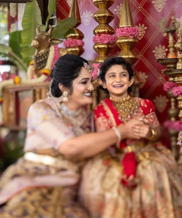 A candid moment of pure joy between a mother and her daughter during a traditional ear piercing ceremony. These are the unscripted memories I love to capture.