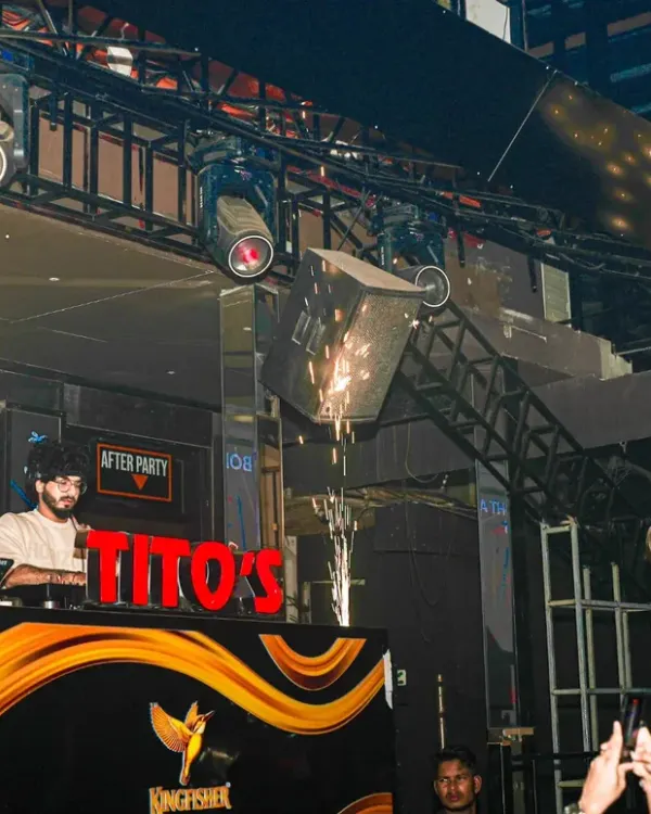 This is the energy I bring to every event. Here I am at the console at Tito's in Goa, one of my resident clubs, during a high-energy set complete with pyrotechnics and champagne showers. This is the full nightlife experience.