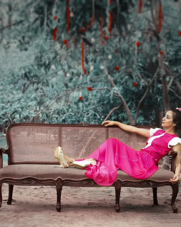 This fuchsia pink pleated maxi dress embodies the indie-chic cocktail vibe. The dramatic, flowing silhouette and bold color make it a statement piece, perfect for an evening party or a creative photoshoot.