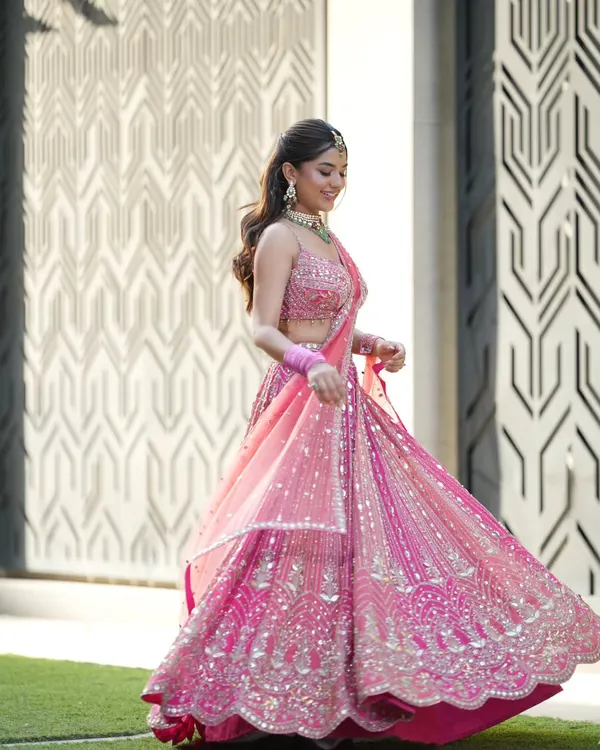 This pink lehenga was made for a fairytale moment. I draped the dupatta to flow effortlessly, allowing for a beautiful twirl that captures the joy of a Mehendi or Sangeet celebration.
