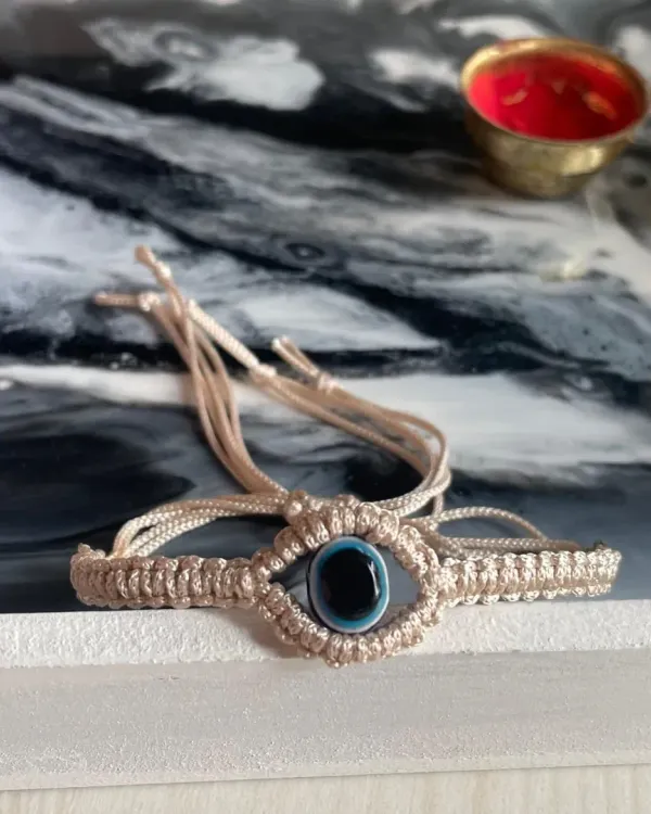 From my Rakhi collection, this is a beautiful evil eye bracelet, hand-knotted to protect the bond you share with your sibling.