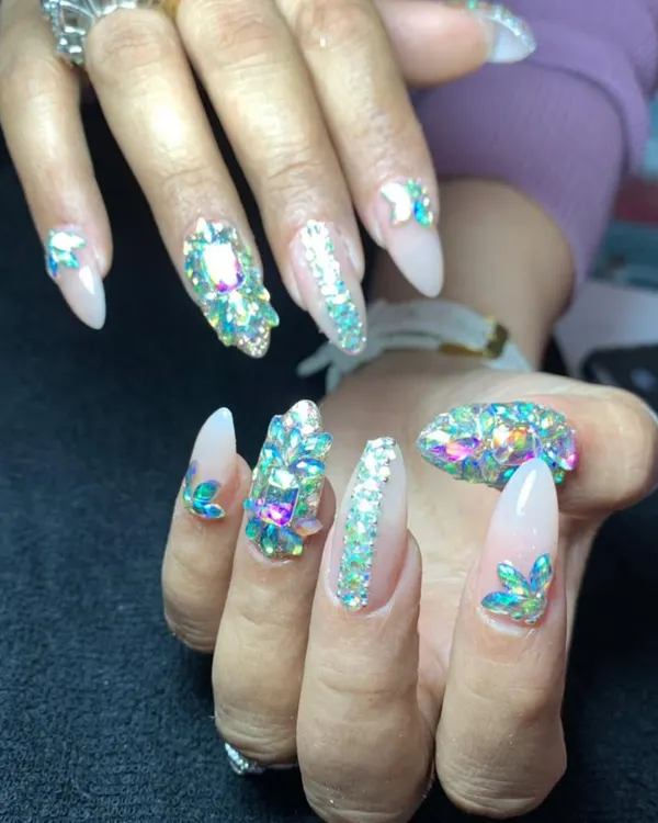 This is my signature, fully loaded crystal look for when you want to make a statement. I use high-quality, brilliant crystals, including genuine Swarovski, to create a dazzling, camera-ready finish on these sharp stiletto nail extensions.