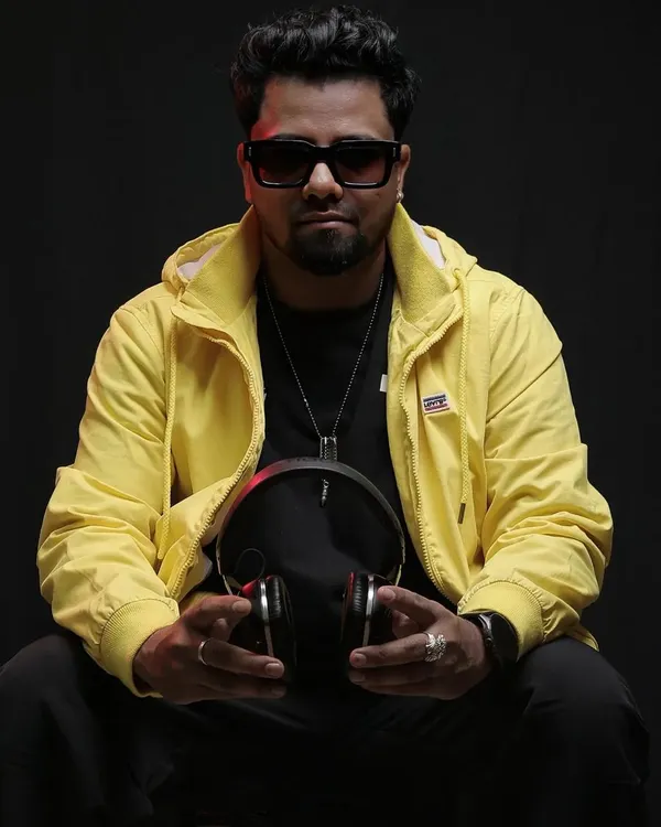 A professional shot from a photoshoot. I believe in presenting a stylish and confident image that reflects the quality and energy of my performances.