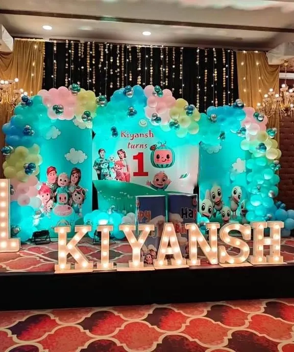 I specialize in creating spectacular stage setups for first birthdays, like this vibrant Cocomelon theme. The design includes a custom backdrop, organic balloon clouds, and large marquee letters spelling out your child's name for a truly memorable celebration.