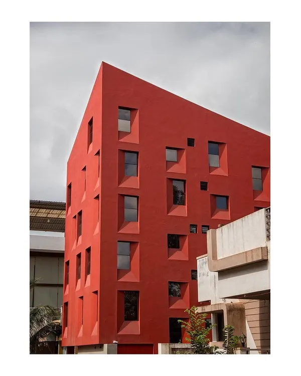Our Stacked Student Housing project, completed in 2016, redefines density on a tight 111.5 Sq.m site. The form and fenestration are a direct product of the building's section, layering private living spaces efficiently.