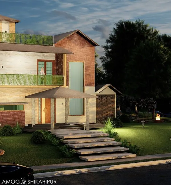 This residence in Shikaripura showcases our holistic approach, where the architecture and the surrounding landscape are designed as one. We created a lush lawn, natural stone steps, and strategic lighting to craft an inviting outdoor experience that complements the home's structure, day and night.