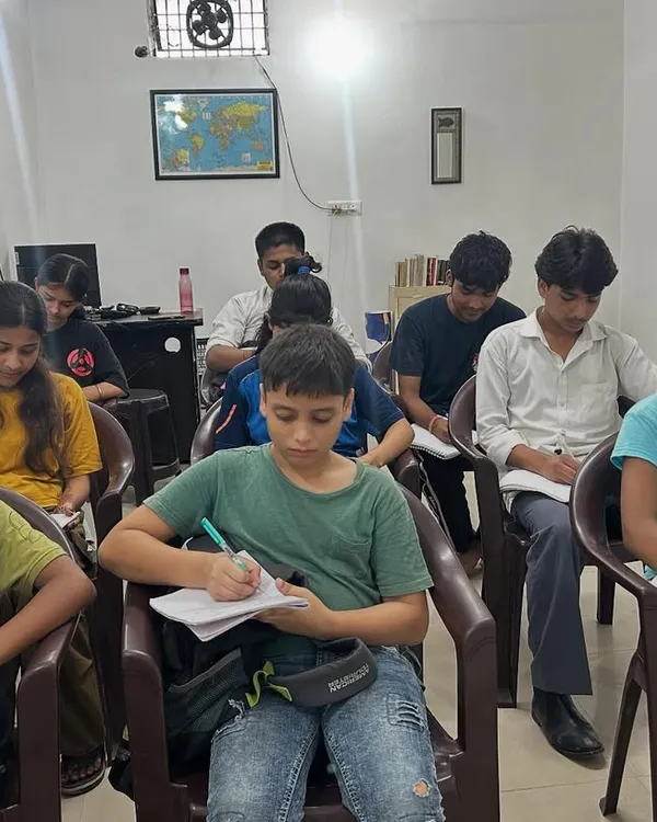 A typical day at the academy where students are concentrating on a test. I ensure the environment is quiet and conducive to deep work, helping them build the discipline required for high school and college-level studies.