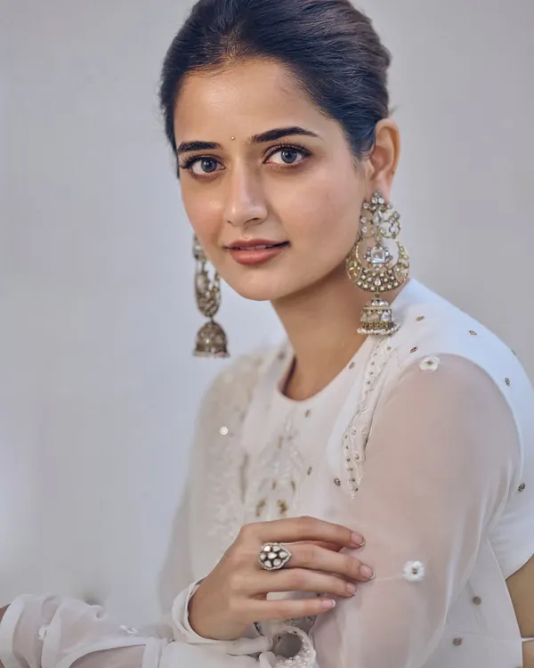 A beautiful portrait of actress Ashika Ranganath wearing my off-white chikankari georgette Anarkali. It features delicate self-pearl and mixed embroidery with a classic bandhgala neckline for a look of pure grace.