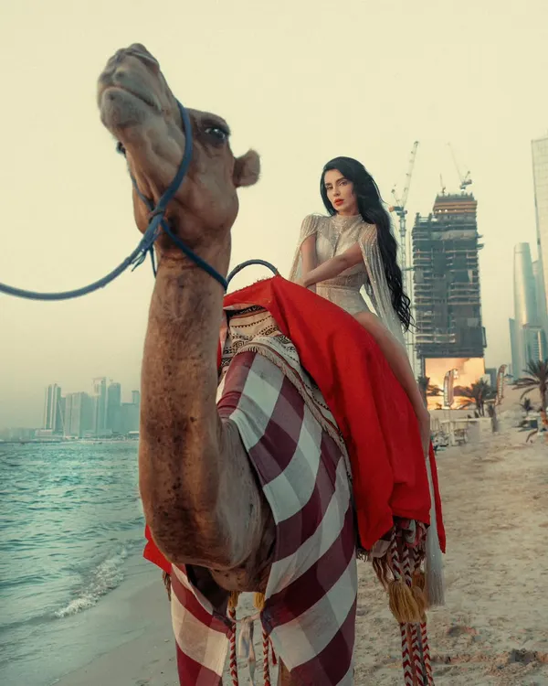 A majestic shot combining the traditional symbol of the desert, a camel, with the modern Dubai skyline. This is the kind of epic destination portrait I love to create.