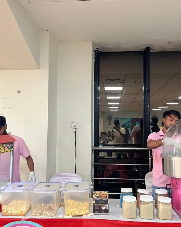 For kids' parties, we can set up fun food stations like this popcorn and cotton candy counter. This was a big hit at a 5th birthday party we catered.
