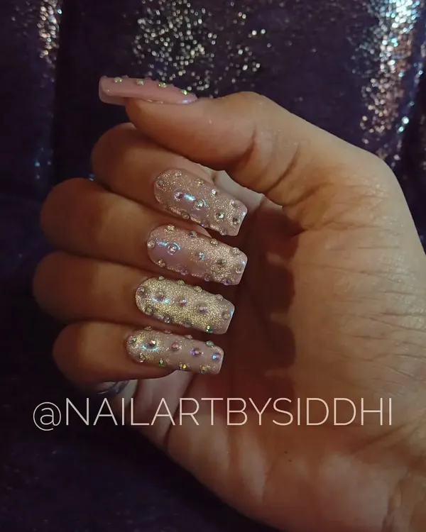A full-on glamour set for a birthday celebration, featuring square-shaped nails completely covered in sparkling Swarovski crystals.