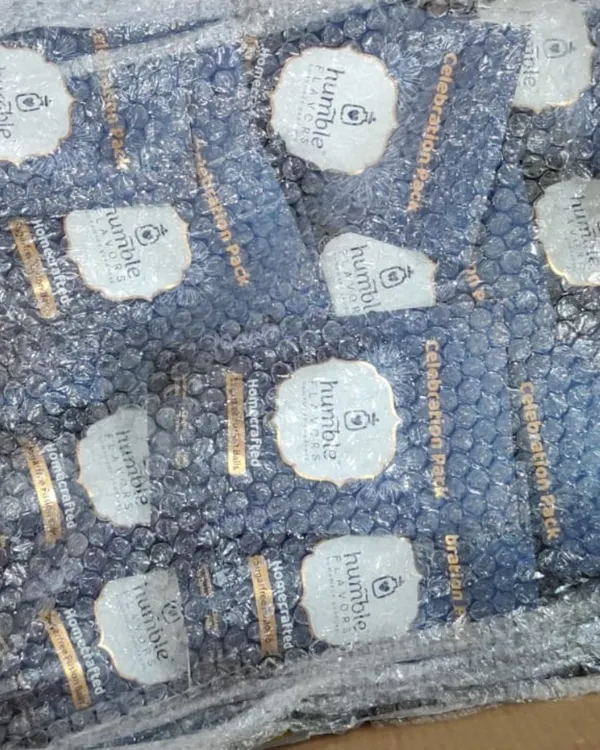 This is what a large corporate order looks like before it heads out for delivery. Here you can see hundreds of pouches of my Fusion Cocoa Balls, all carefully bubble-wrapped to ensure they arrive safely. Fulfilling these large orders is a challenge I truly enjoy.