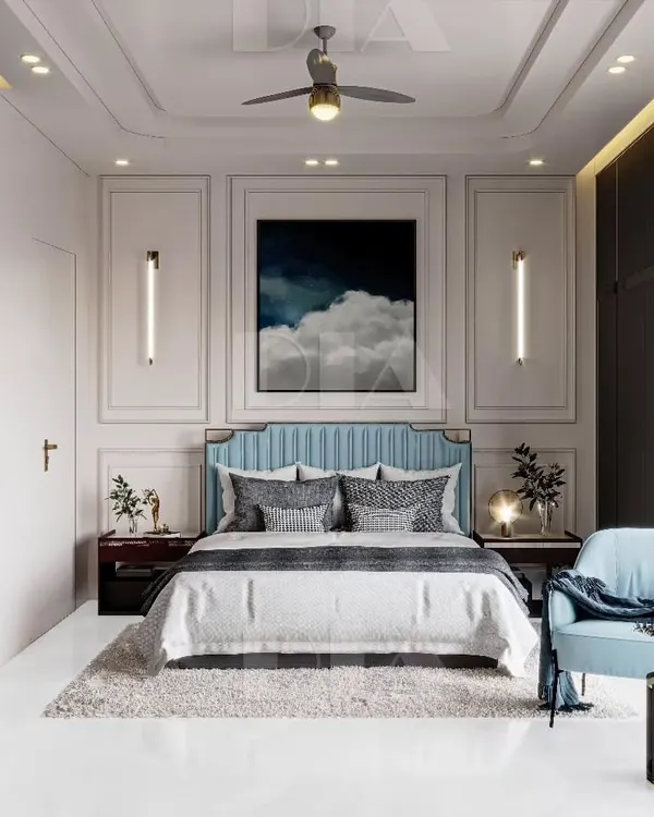 A master bedroom design that blends classic and contemporary styles. Elegant wall molding provides a sophisticated backdrop for a modern upholstered bed, complemented by sleek vertical wall lights and handleless wardrobes.