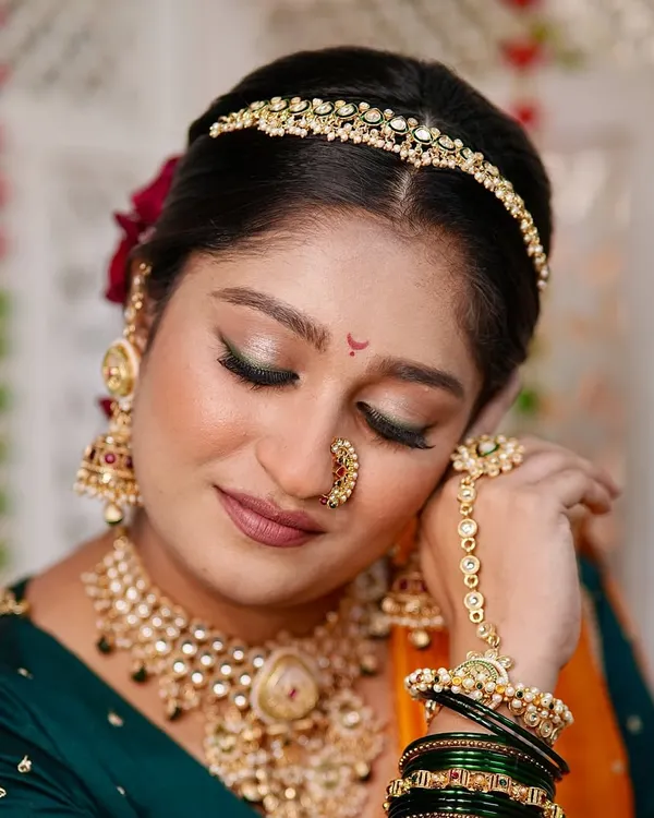 A modern fusion look that unites tradition with artistic elegance. Here, I paired a soft, shimmery eye with a matte lip to complement the bold colors of her outfit and the contemporary jewellery.
