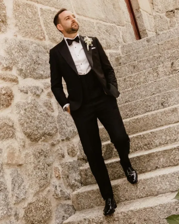 I believe a groom's attire should be as memorable as the occasion itself. This custom-tailored classic black tuxedo, created for an international client, features a flawless fit and timeless elegance, ensuring you look and feel your best on your wedding day.