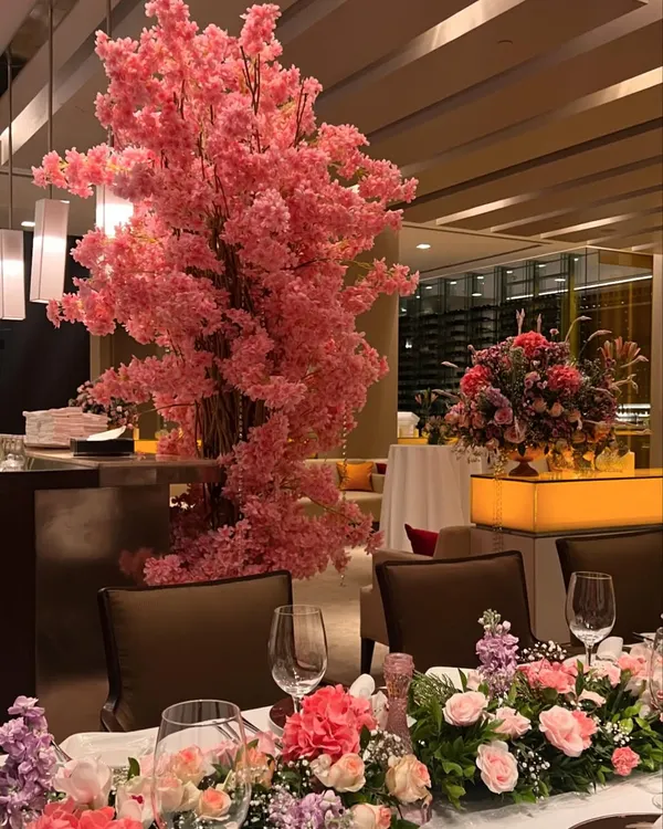 We created a dreamy pink floral escape at The Oberoi, Mumbai. The centerpiece of the room was a magnificent, life-sized pink cherry blossom tree that added a touch of magic and romance to the intimate dinner setting.