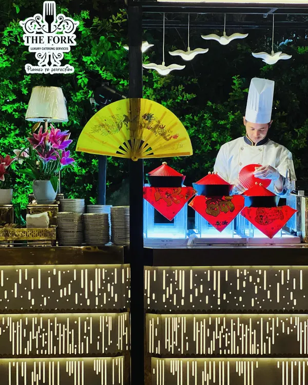 I bring the theater of cooking to your event with interactive live stations. Here, one of my chefs prepares authentic Pan-Asian cuisine, offering guests a fresh, engaging, and personalized dining experience that becomes a highlight of the occasion.