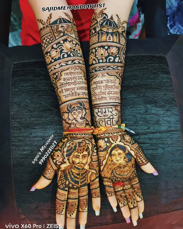 This design is a perfect example of my signature portrait work. I created lifelike, detailed portraits of the bride and groom on the palms, making them the centerpiece of the henna. The design also incorporates sacred Sanskrit shlokas and architectural motifs, telling a complete story on the bride's hands.