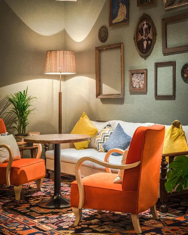 This restaurant and bar is a melange of individualistic spaces. A 30-foot tall library with a regal chandelier and spiral staircase creates a vintage vibe, while versatile seating and minimalist lighting evoke a sense of nostalgia and comfort.