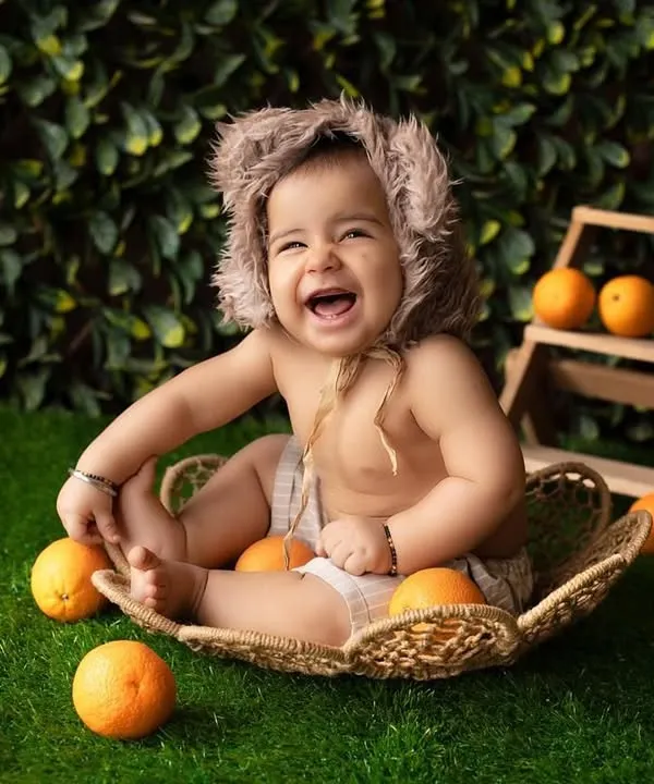 This is the kind of pure, uncontainable joy I live to capture. This little sunshine’s laugh during his sitter session was absolutely infectious, and we created this vibrant, happy setup with oranges to match his bright personality.