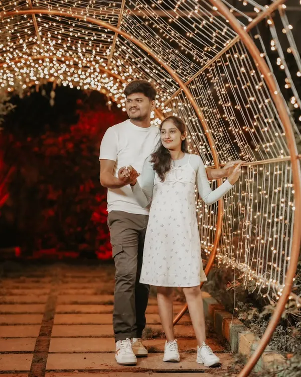 A beautiful portrait of a couple inside a tunnel of warm fairy lights. Night shoots like this create a dreamy and incredibly romantic atmosphere.
