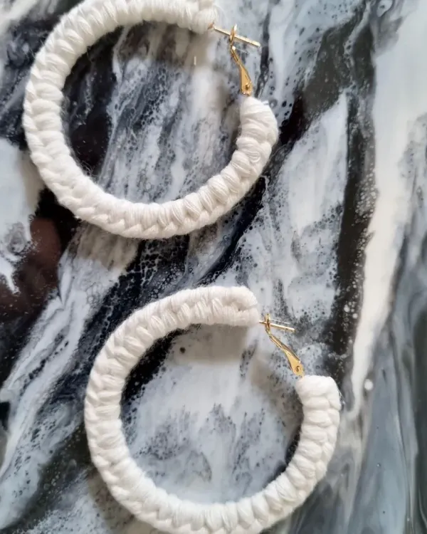 My classic macrame hoop earrings in a clean, natural white. They are incredibly lightweight and add a touch of bohemian elegance to any look.