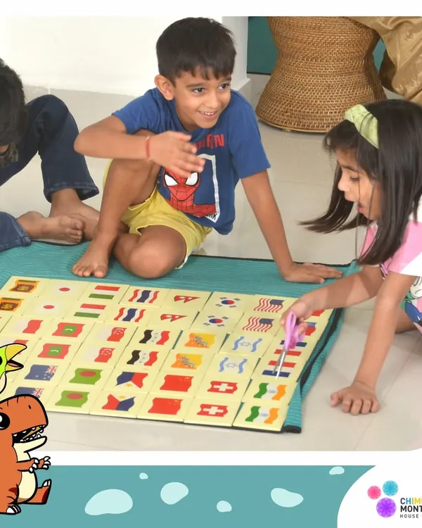 Friendship begins with shared exploration. Here, two children work together on a flag matching game, learning about the world and each other.