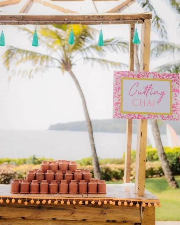 A "Cutting Chai" station set up by the water, with traditional clay kullads ready for serving. This adds a wonderfully authentic and rustic Indian touch to any event.