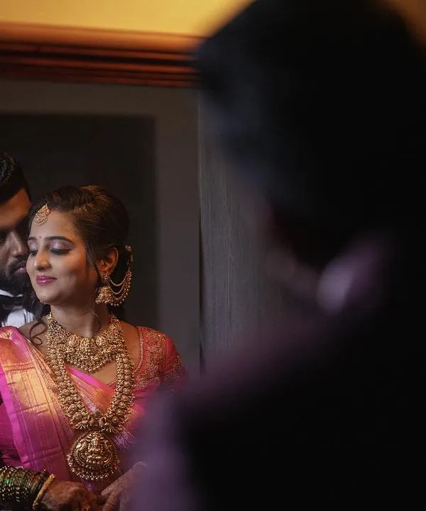 A reflective portrait of a couple during their evening reception. I often use creative compositions, like this shot in a mirror, to add an artistic and intimate feel to my wedding reception photography.