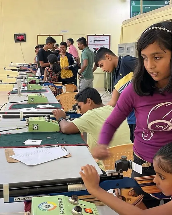 Young participants learning to handle air rifles at the 10m shooting range. I provide hands-on guidance to ensure every child learns safely and effectively.