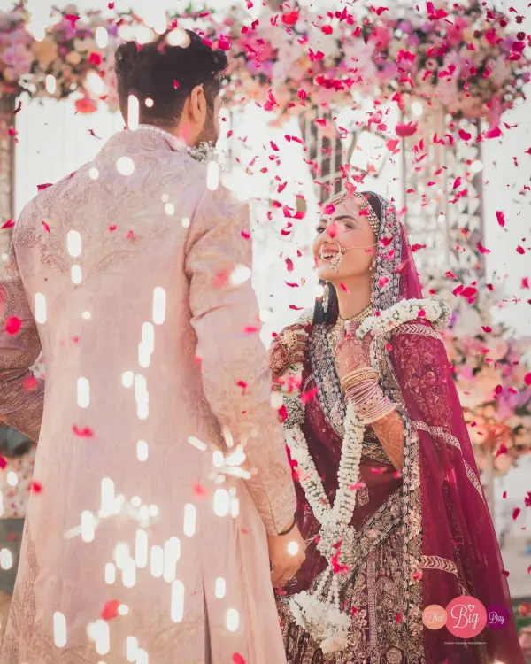 The moment of "I do," showered in a confetti of rose petals. This is the peak of joy, the beginning of forever for Bhavita and Neil, and we capture it in all its glory.